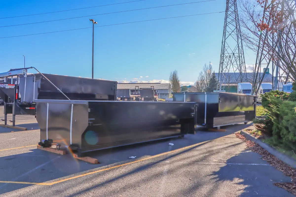 Roll-off dumpster ready for waste disposal at job site for 12 Yard Dumpster Rental in Caldwell